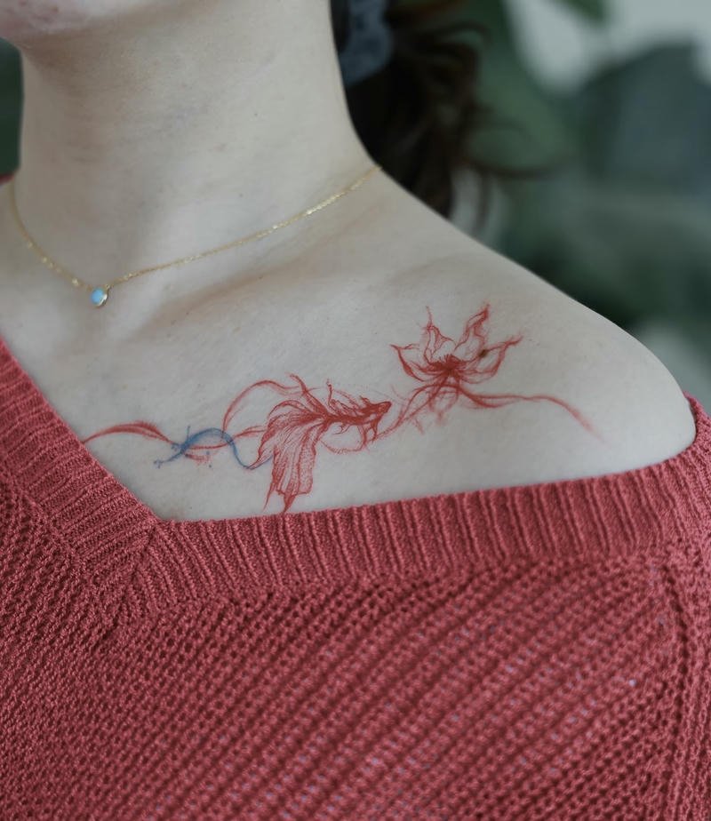 Hình ảnh tattoo cá chép và hoa sen dịu dàng