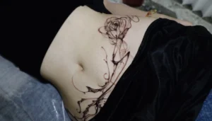 hình xăm bụng nữ thumbnail