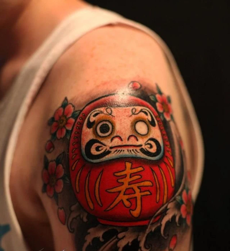 Daruma tattoo với họa tiết hoa anh đào hài hòa
