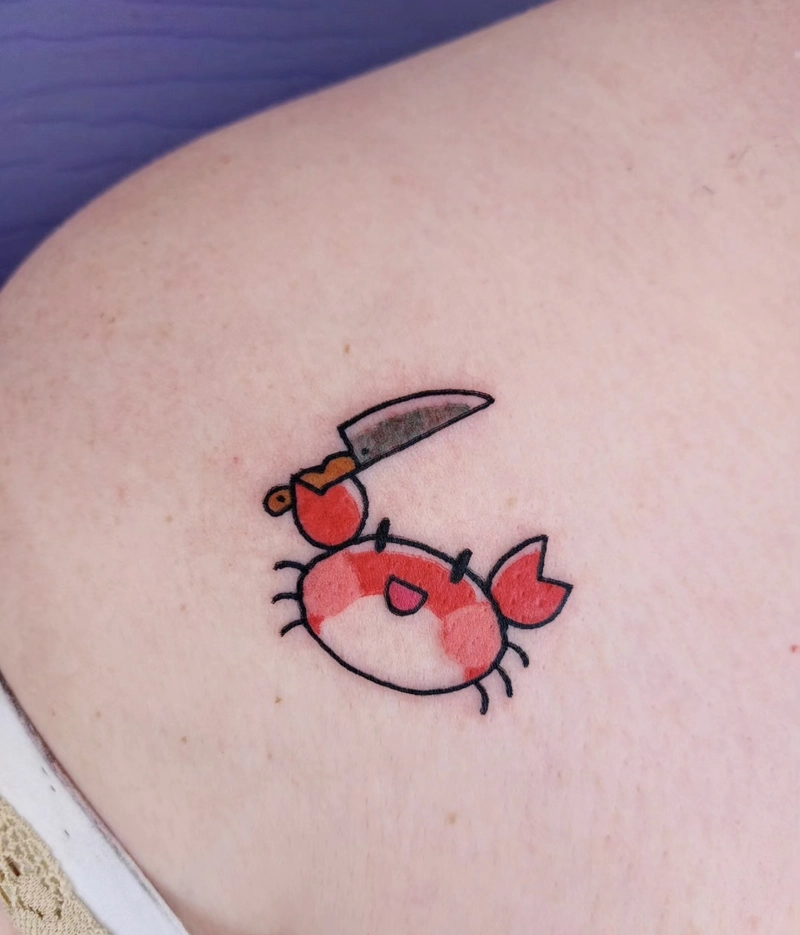 Mẫu hình xăm con cua đang cầm dao