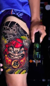 Mẫu xăm daruma nửa tay với bố cục cân đối đẹp mắt