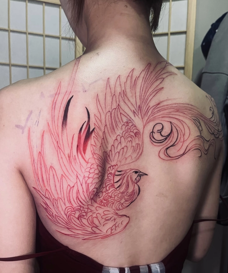 tattoo phượng hoàng hồng rực rỡ kín một bên lưng