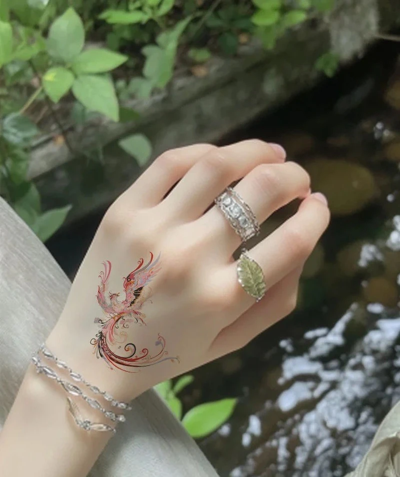 Hình xăm phượng hoàng lửa cho nữ ở eo